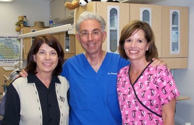 Dr. Hann volunteering at community dental outreach event in Skokie, IL